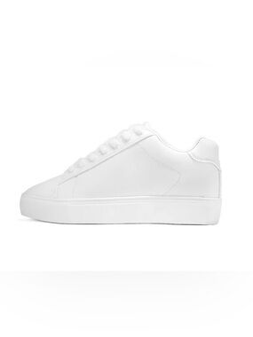 2.4" height boost encapsulated in a triple white, classic court style sneaker